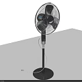 Standing Air Cooler Fan With Black Base Silver Blades Electric Cord On Light Surface