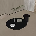 Modern Round Black Coffee Table With Sleek Design Topped With Book White Plate And Fruits