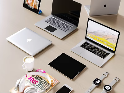 Stylish Silver Laptops With Tablet Smartphone Smartwatch Magazine And Coffee Cup On Desk 3d model