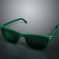 Green Sunglasses With Square Frame Green Lenses And Metal Rivets On Smooth Reflective Surface