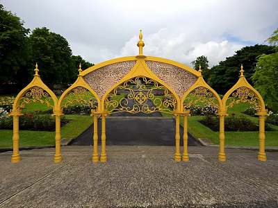 Yellow Arched Event Gateway Metal Structure With Ornamental Patterns Green Trees Blue Sky 3d model