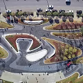 Urban Plaza Landscape With Winding Pathways Green Lawns Trees And Pedestrians