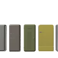 Vintage Retro Refrigerators In Multiple Colors Display On Wooden Floor With Light Wall