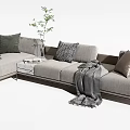 Modern Light Colored Sectional Sofa With Throw Pillows Blankets Side Table And Green Plant 3d model