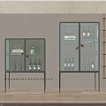 Two Modern Wine Cabinets With Glass Doors Wine Bottles Glasses And Interior Lighting