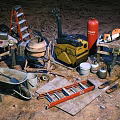 Essential Industrial Equipment Including Ladder Cement Mixer Wheelbarrow And Tools For Worksite