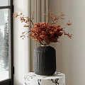 Black Textured Ceramic Vase With Dried Red Brown Branches Placed By Window With Snowy View
