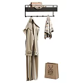 Beige Soft Bathrobe Hanging On Black Rack With Striped Towel And Paper Shopping Bag