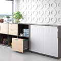 Modern Bookcase Storage Unit With Multiple Compartments Drawers Closed Cabinets Files And Potted Plants