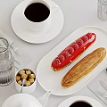 Delicious Raspberry Eclair And Striped Pastry With Coffee And Sugar Cubes On Table