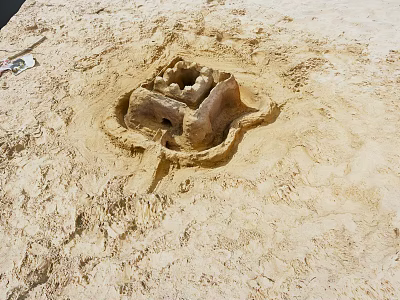 Intricate Sandcastle Structure On Sandy Ground With Detailed Design And Small Openings 3d model