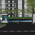 Modern High Rise Apartment Building With Entrance Gate Green Trees And Driveway