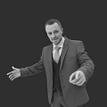 Professional Business Man In Formal Suit With Tie Gesturing Against Dark Background