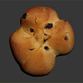 Golden Flower Shaped Raisin Bread With Shiny Crust On Black Background