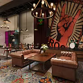 Vibrant Bar Interior Featuring Colorful Tiled Floor Pendant Lights Tables And Chairs