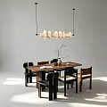 Modern Minimalist Dining Table With Wooden Top Surrounding Chairs Vase With Twigs And Pendant Light
