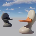 Duck Shaped Leisure Chairs in Gray and White with Orange Beak Under Blue Sky