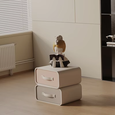 Light Colored Nightstand With Two Drawers And Human Shaped Figurine On Top 3d model