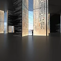 Art Installation With Tall Columns Featuring Calligraphy In Spacious Modern Interior With Standing Person