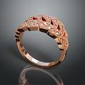 Fashionable Rose Gold Ring Adorned With Red Gemstones And Intricate Filigree Design Details