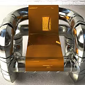 Modern Single Sofa With Silver Metal Pipe Frame And Shiny Orange Seat