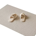 Beige Flip-Flops Placed On Beige Woven Mat For Cozy Home Use