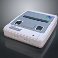 Vintage Electronic Gaming System With White Gray Body Slot Black Buttons And Colorful Logo