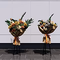 Floral Decorative Arrangement With Brown Paper Wrapped Bouquets Orange Ribbon On Black Stand White Wall