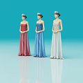 Three female models in red blue white long dresses with headpieces against blue background