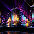 Vibrant Stage Setup With Colorful Lights And Large Screens For Event Performance