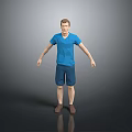 Man In Blue T Shirt And Blue Shorts Standing Against Gray Background