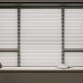 Window Blinds In Cozy Interior With Window Sill Pillow Book And Plant