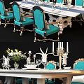 Elegant Classic Dining Table Set With Blue Chairs Gold Accents Flower Vase And Candle Holders