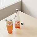 Bottle and Glass with Orange Drink Rosemary Lemon Slice on Light Wooden Table by Window