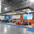 Segway Exhibition Booth In Indoor Hall With Large Screens And Displayed Vehicles