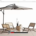 Outdoor Rattan Table And Chair Set With Umbrella On Wooden Deck