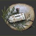 Traditional Christmas Stollen Cake on Wooden Base with Snow and Decorations