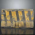Worn Concrete Traffic Barrier With Yellow And Black Stripes And Textured Surface
