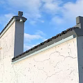 Warm Yellow Decorative Lights Illuminating Traditional Building Walls With Black Tiled Roof At Night