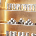 Beauty Salon Display Shelves With Arched Design Warm Lighting And Neatly Arranged Products