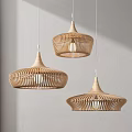 Three Minimalist Modern Woven Pendant Lights With Dome Shaped Design Hanging On Light Colored Wall