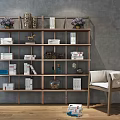 Wooden Shelving Unit with Books Ornaments Purple Vases and White Cushion Chair against Gray Wall