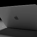Sleek Portable Laptop With Screen Showing App Icons And Connected Power Cable