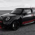 Black Mini Cooper Sporty Car With Red Accents And High Performance Design On Open Road
