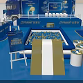 Blue Exhibition Booth Design With Multiple Display Screens And Seating Areas 3d model