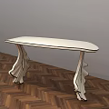 Stylish White Accent Table with Curved Legs Design on Herringbone Wooden Floor and Gray Wall