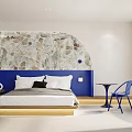 Modern Hotel Room With Stone Pillar Cozy Sofa And Blue Chairs