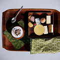 Cream Dessert with Chocolate Sprinkles on Wooden Tray featuring Yellow Cup Square Pastries Green Napkins