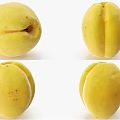 Fresh Ripe Yellow Apricots Whole and Halved Displaying Natural Spots on White Background