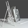 Art Supplies Display on Easel with Canvas Pencil Sketch and Still Life Objects